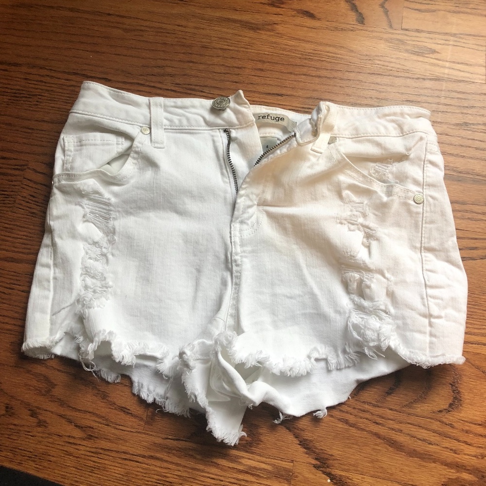 Distressed white jean shorts